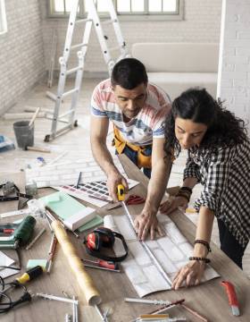 Couple making home improvement and measuring Couple making home improvement, measuring, high angle view.